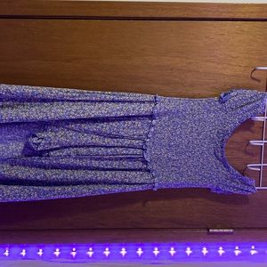 Is a blue dress with yellow flowers on it